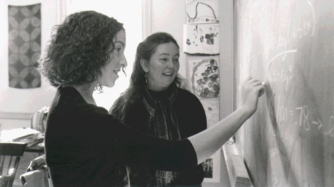 Dorothy Wallace and Heidi Williams '03 at blackboard